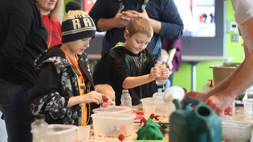Dinosaurs and Disasters activity with makeshift rain bottles and environments.