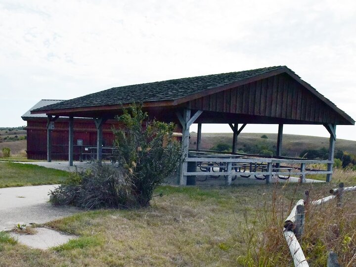 Wooden covered picnic pavilion with variety of picnic tables
