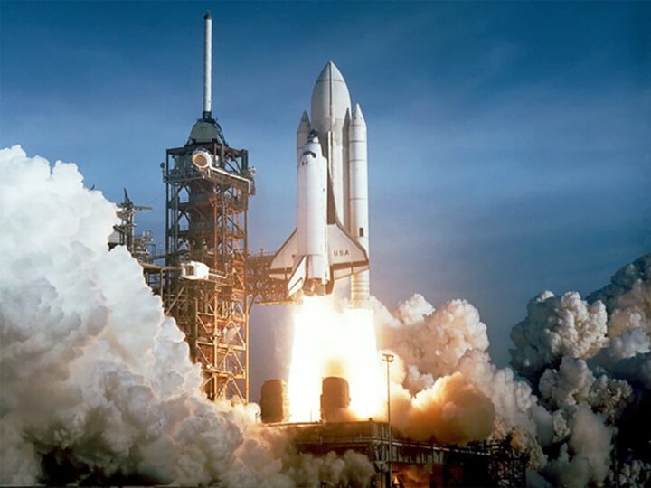 A shuttle being launched into space with rockets. 