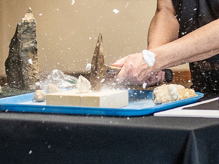A hammer smashes a geode